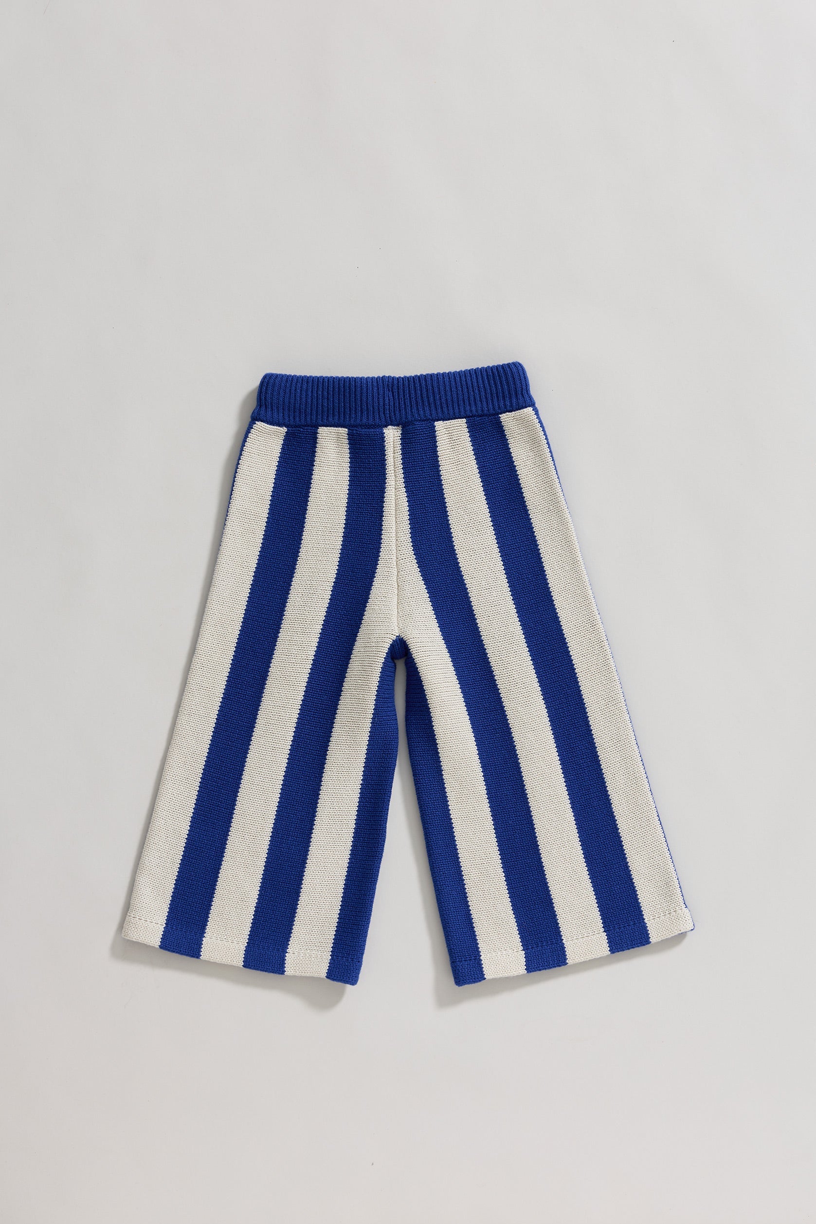 Blue and white striped pants on a light gray background